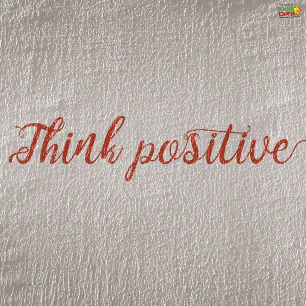 Text "Think positive" in elegant red script on textured silver background, radiating motivation and encouragement. Upper-right logo features a star.