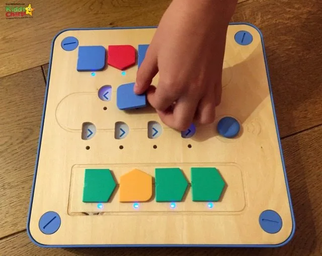 Cubetto teaches coding by enabling you to more the robot using little counters, which represent a program.