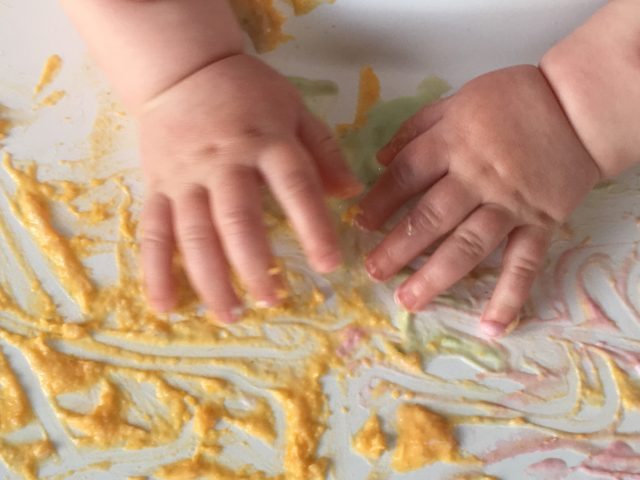 Get messy and have fun with your baby! This sensory finger painting activity for babies is tasty fun too!