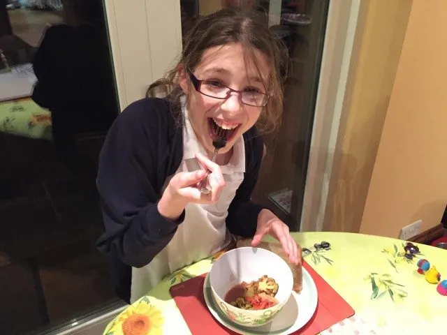 My daiughter enjoying the beef stew quick recip-e - easy to prepare before school, and just as easy to eat!