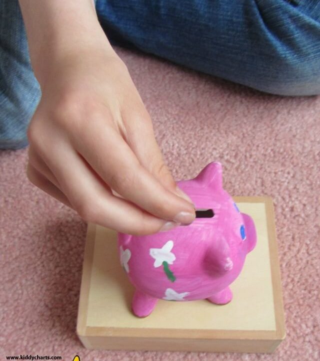Putting our money in the Jacdo craft kits piggy bank :-D
