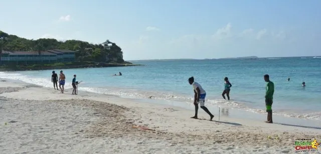 Playing cricket with the locals in Long Bay near the Verandah Resort and Spa