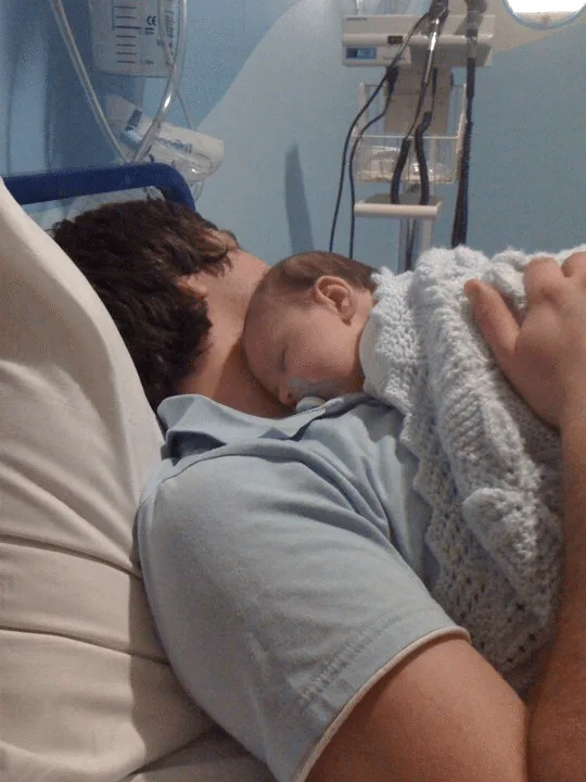 Silent reflux in babies: Eli happy asleep on daddy