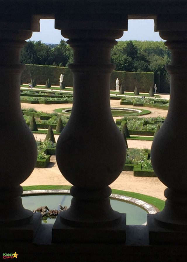 Versailles parterre garden through a balcony in the public apartments - it pays to play with those angles; and kids will love doing it too!