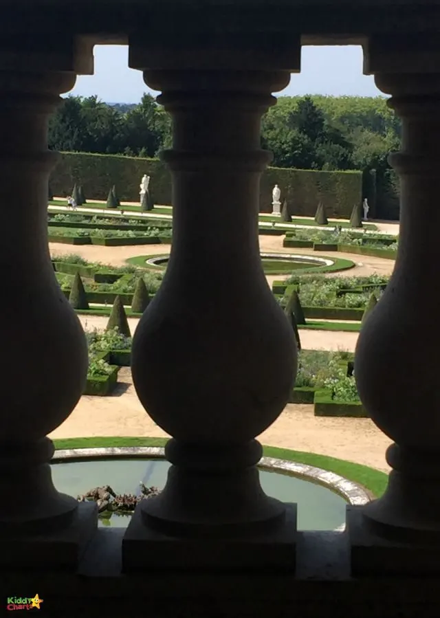 Versailles parterre garden through a balcony in the public apartments - it pays to play with those angles; and kids will love doing it too!